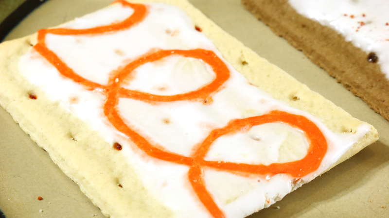 Illustration for article titled Snacktaku Eats A&W Root Beer And Orange Crush Pop-Tarts